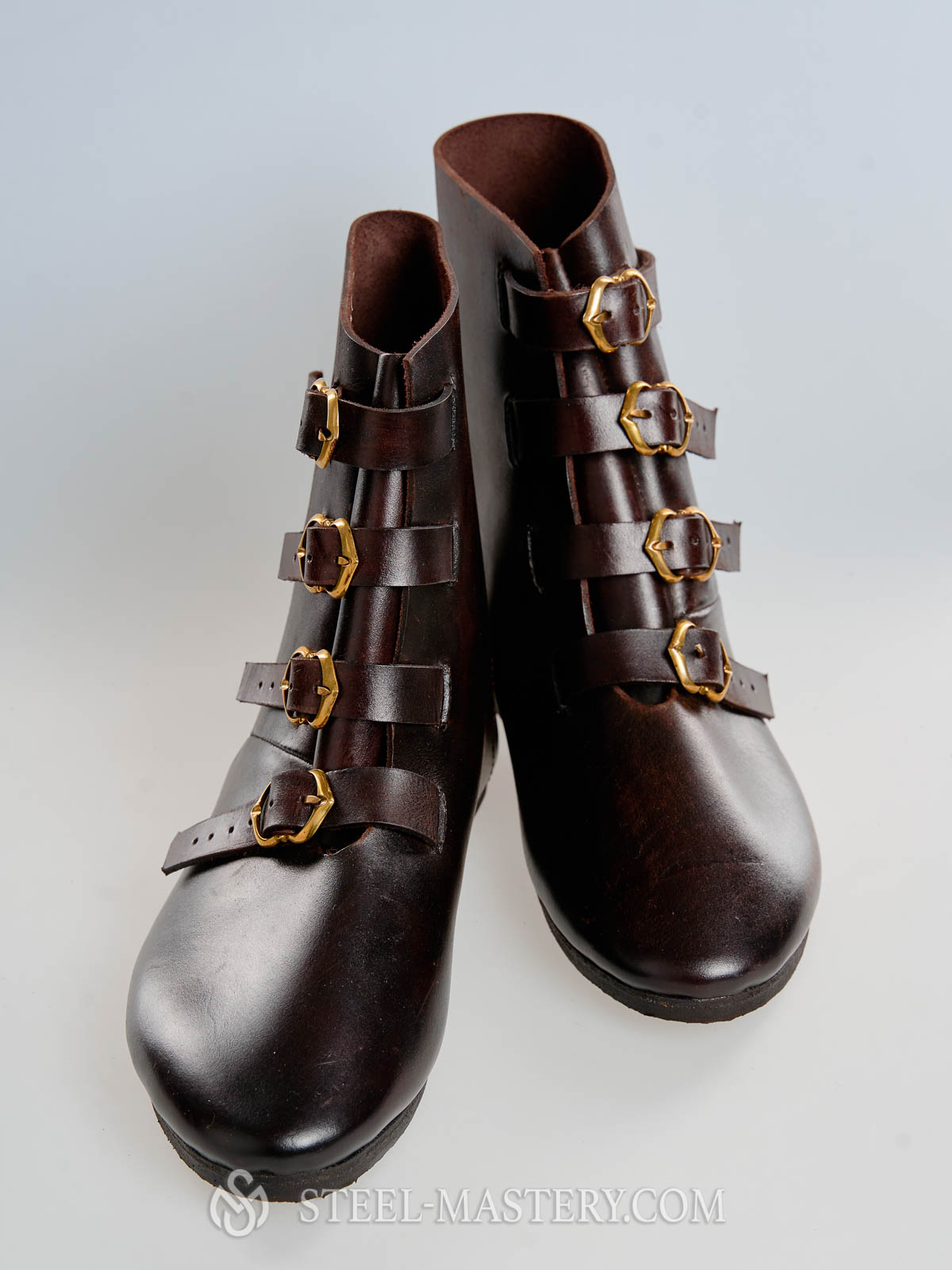 Medieval leather high boots with buckles