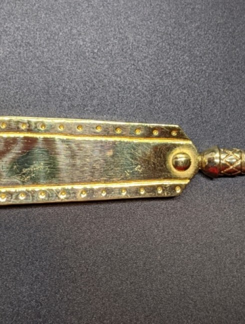 Medieval decorative bronze strapend with mount Strapends