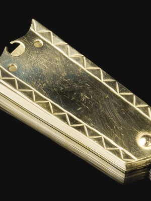 Medieval decorative strapend with mount Strapends