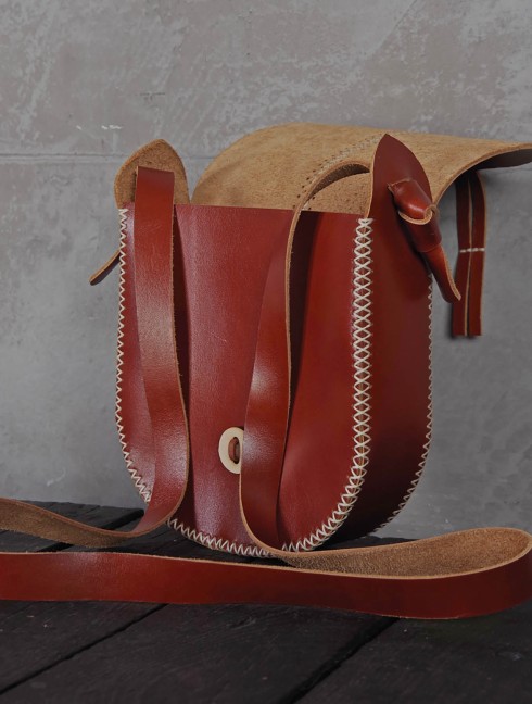 Leather bag with hand-made stitching