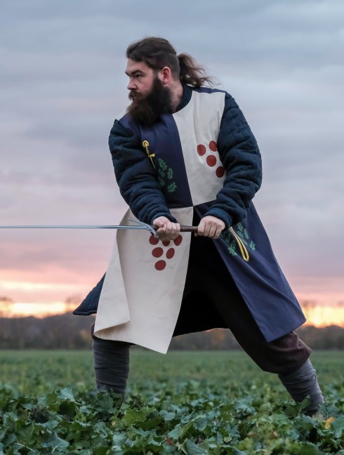 Tabard with silk-screening of scarlet dots, golden swords, and green oak leaves 
