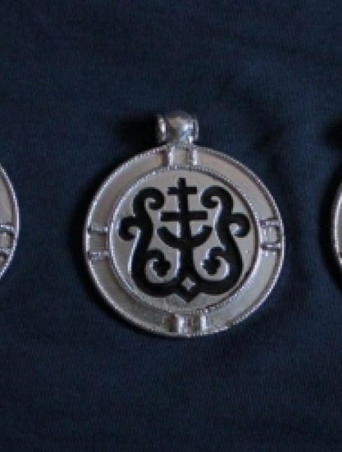 Pendant with a cross and heraldic ornaments 