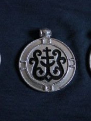 Pendant with a cross and heraldic ornaments 