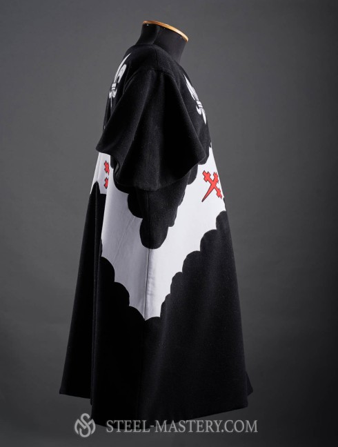Black tabard with a helmet, white lilies and crosses Tabards
