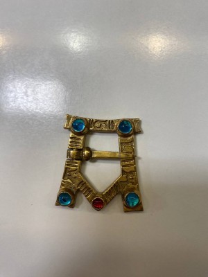 A-shaped brooch with glass gems 1 pc
