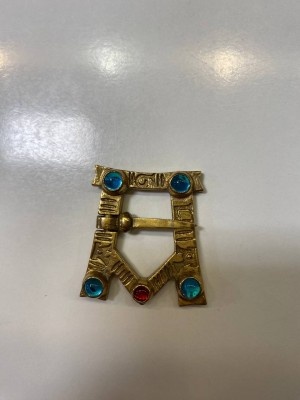 A-shaped brooch with glass gems 1 pc