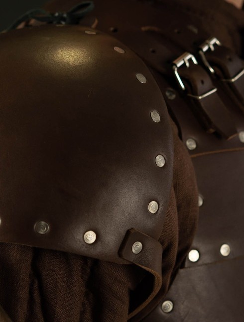Whole hammered spaulders covered with leather
