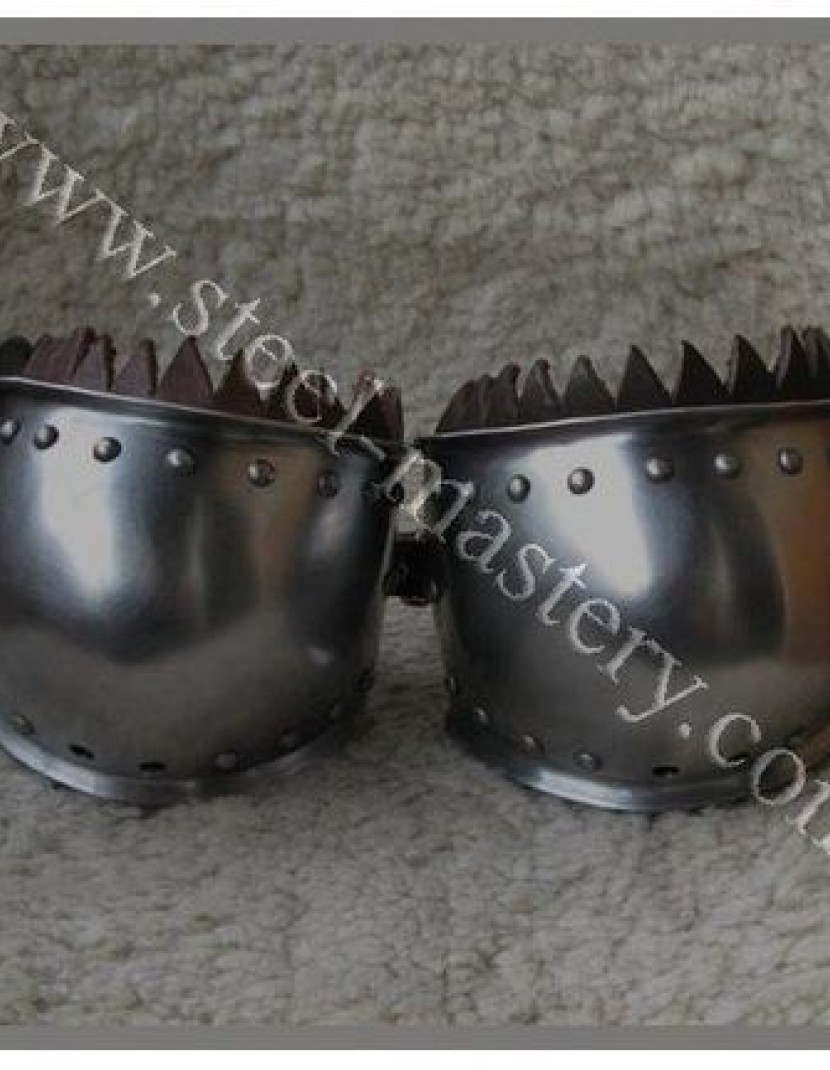 Elbow caps with chased rondel photo made by Steel-mastery.com