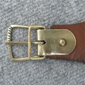 Fastenings: leather straps with handcrafted brass buckles