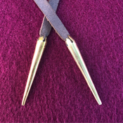 Fastenings: leather laces with brass points