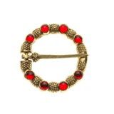 Attire: Brooch with glass gem